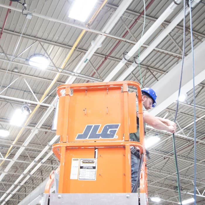 installer-on-lift-wiring-fixture-2